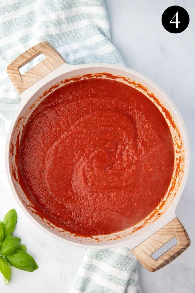 tomato pasta sauce in a white pan.