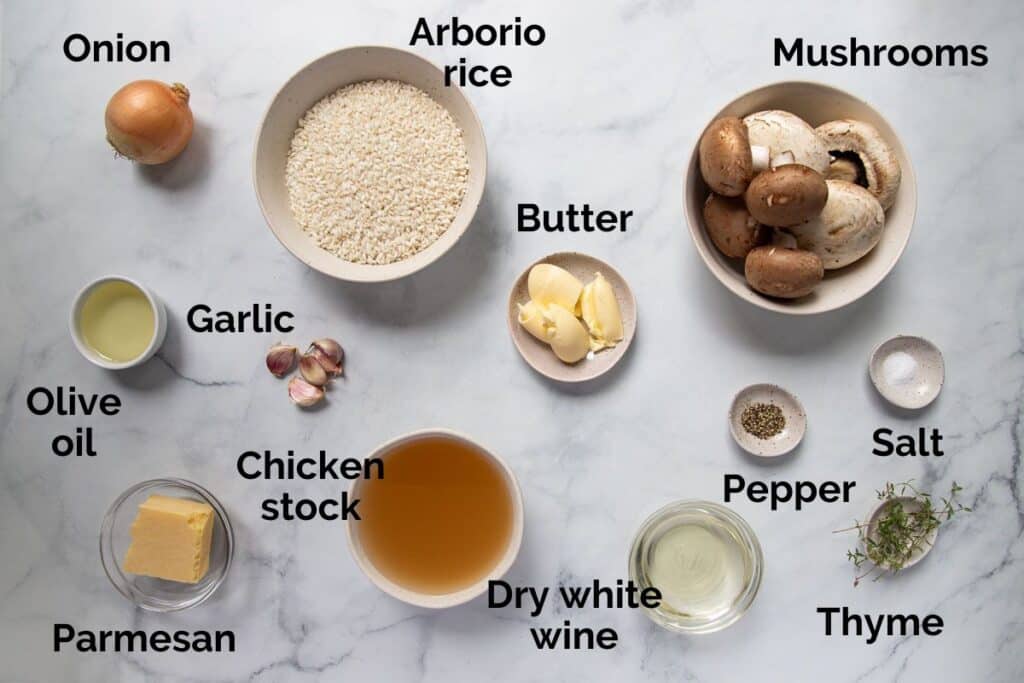 all ingredients for slow cooker risotto, laid out on a table.