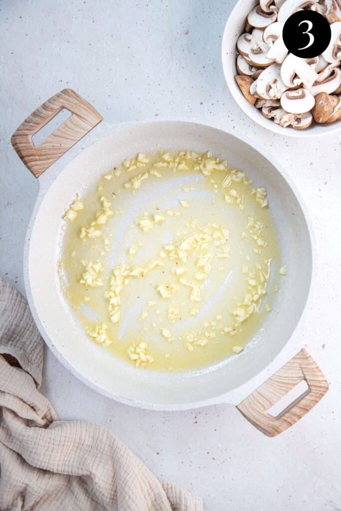 oil and garlic, frying in a pan.