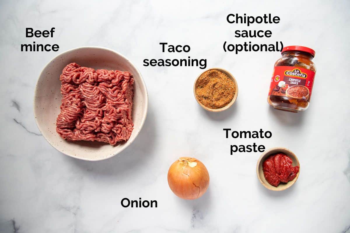 all ingredients for beef taco meat, laid out on a table.