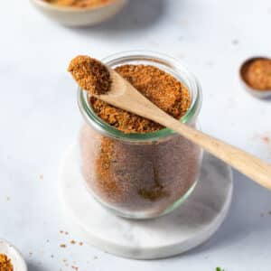 a jar of taco seasoning on a table.