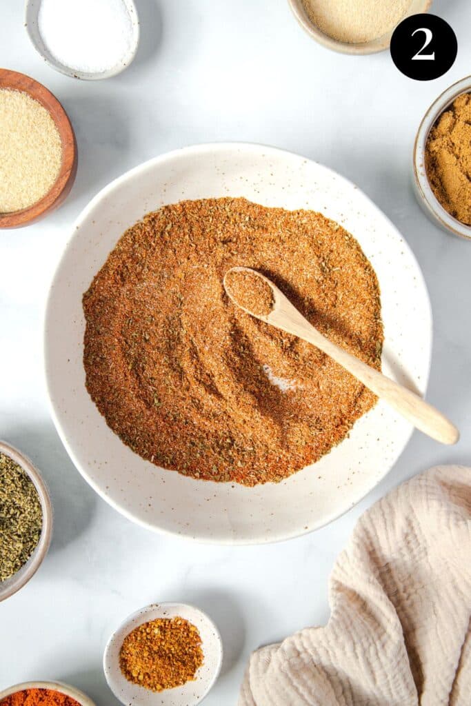 homemade taco seasoning, mixed in a bowl with a spoon.