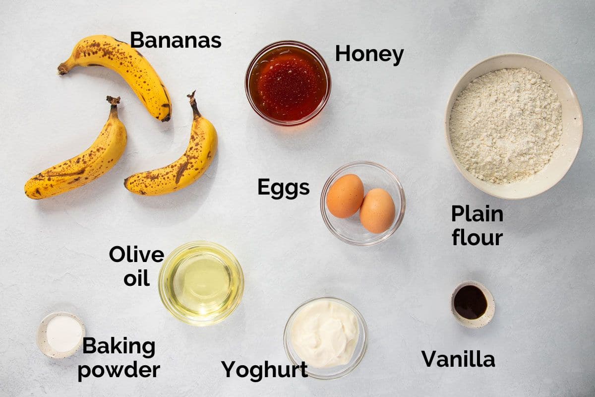 all ingredients for banana honey muffins, laid out on a table.
