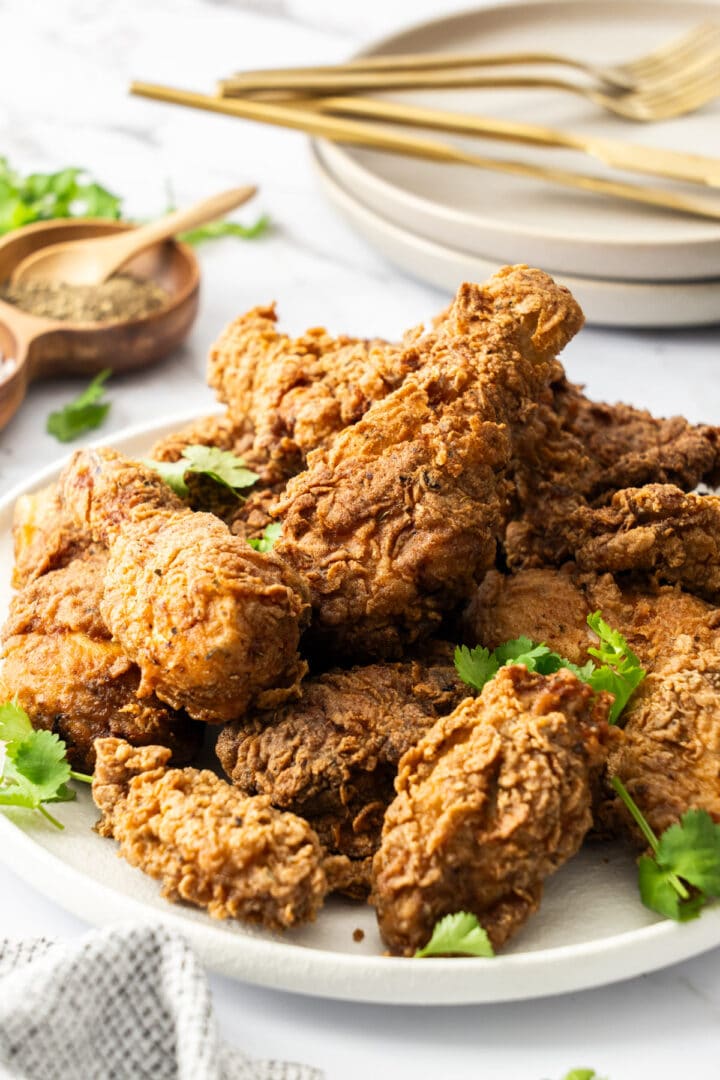 a plate of fried chicken on a table.