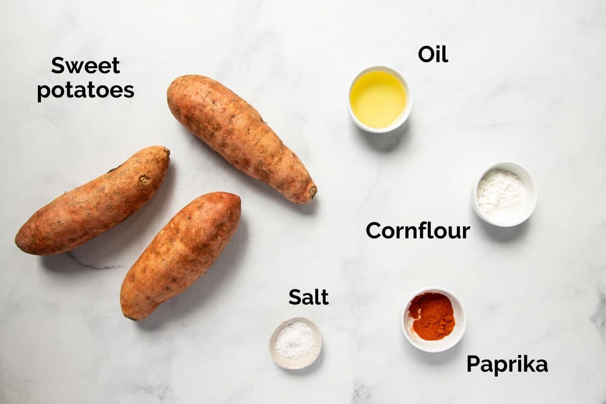 all ingredients for sweet potato fries, laid out on a table.