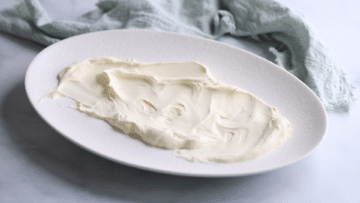 whipped cream spread over a plate.