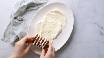 chocolate ripple cake being assembled on a plate.