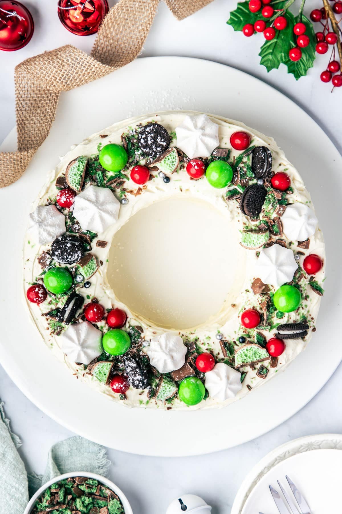 chocolate ripple cake shaped into a wreath and decorated with Christmas chocolates.