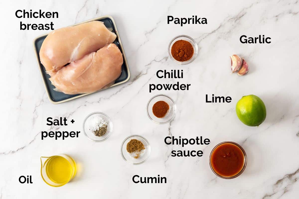 ingredients for chicken tacos, laid out on a table.