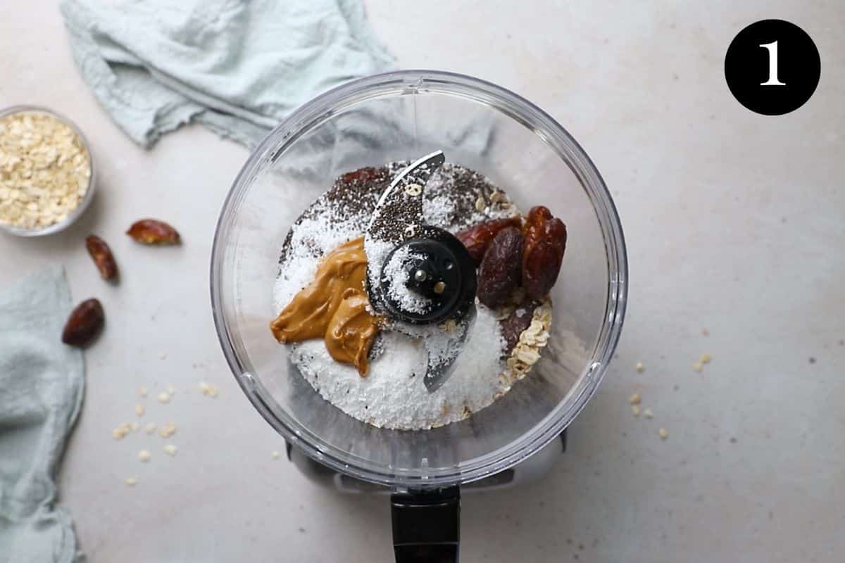 dates and bliss ball ingredients in a food processor.