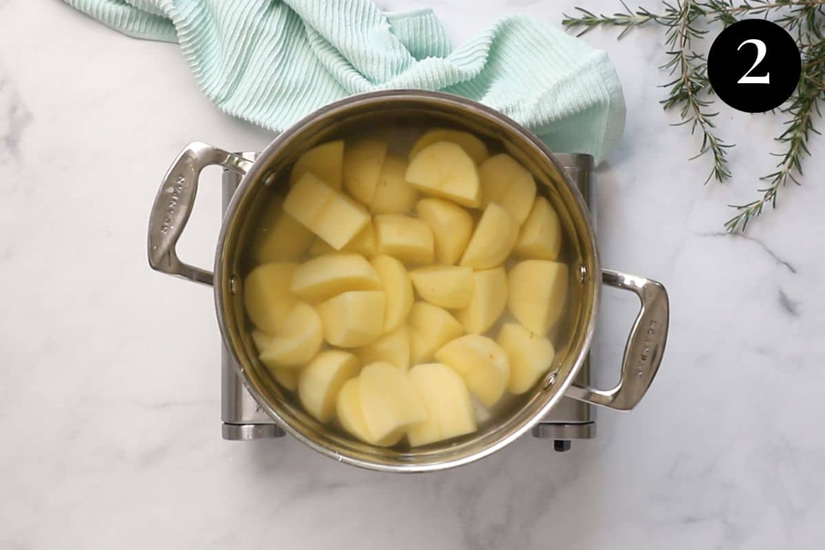 a pot of potatoes in water.