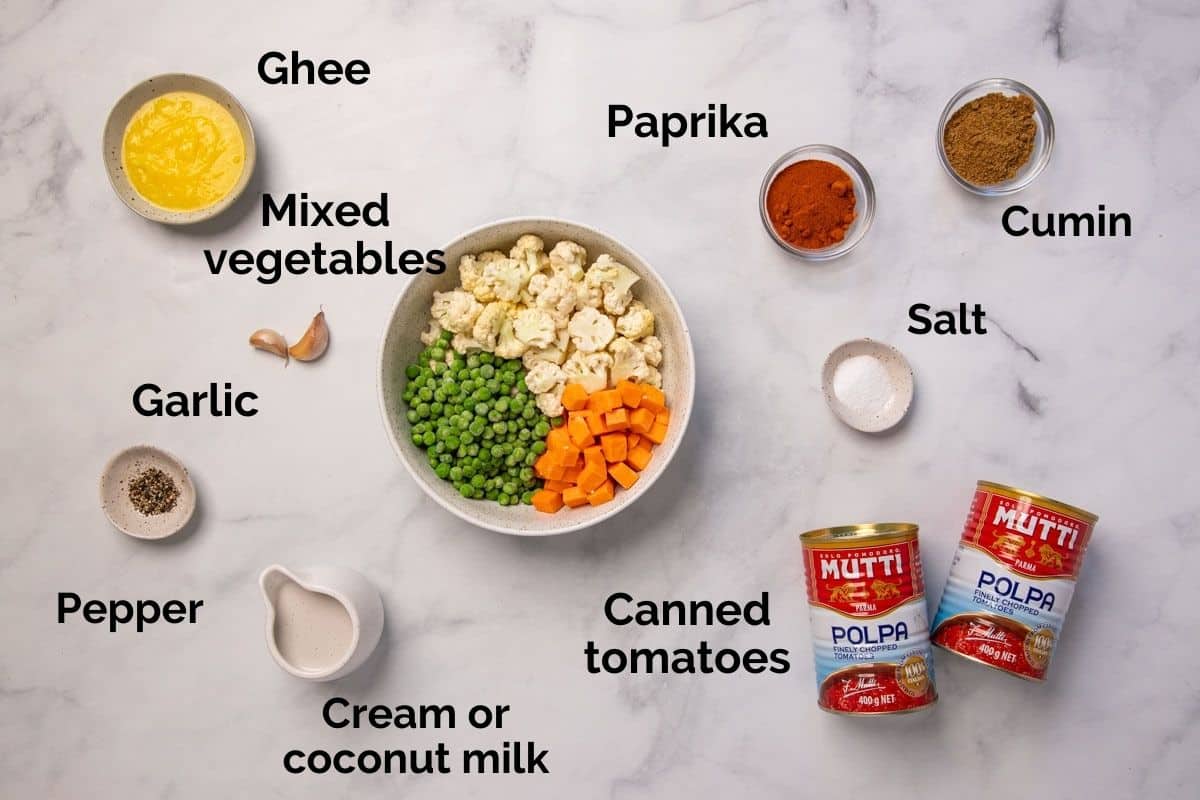 remaining ingredients for tikka masala with vegetables, laid out on a table.