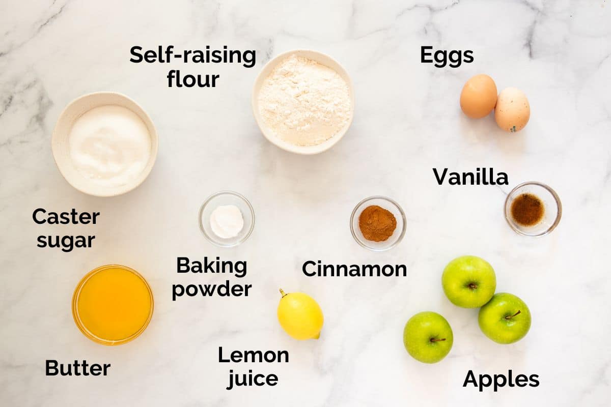 all ingredients for apple tea cake, laid out on a table.