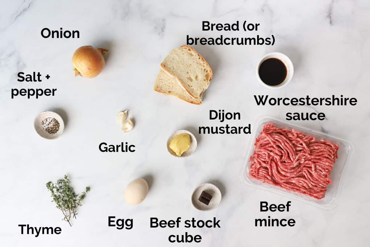 all ingredients for beef rissoles, laid out on a table.