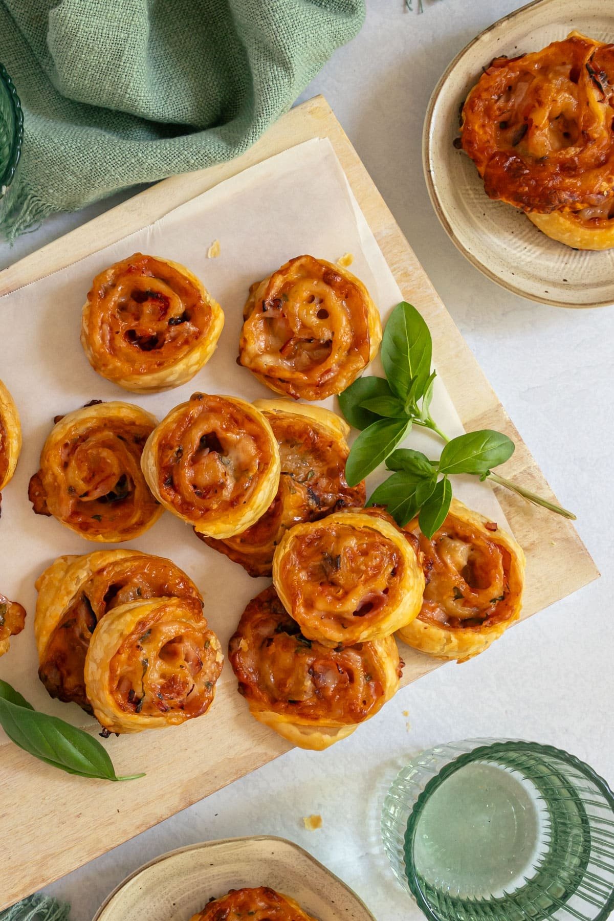 pizza scrolls spread over a wooden board.