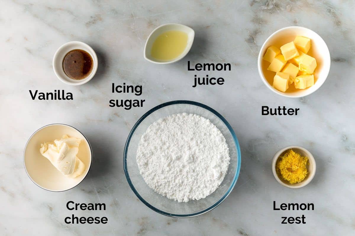 ingredients for lemon cream cheese frosting, laid out on a table.