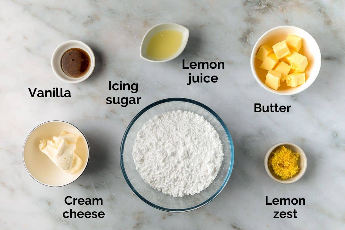 ingredients for lemon cream cheese frosting, laid out on a table.
