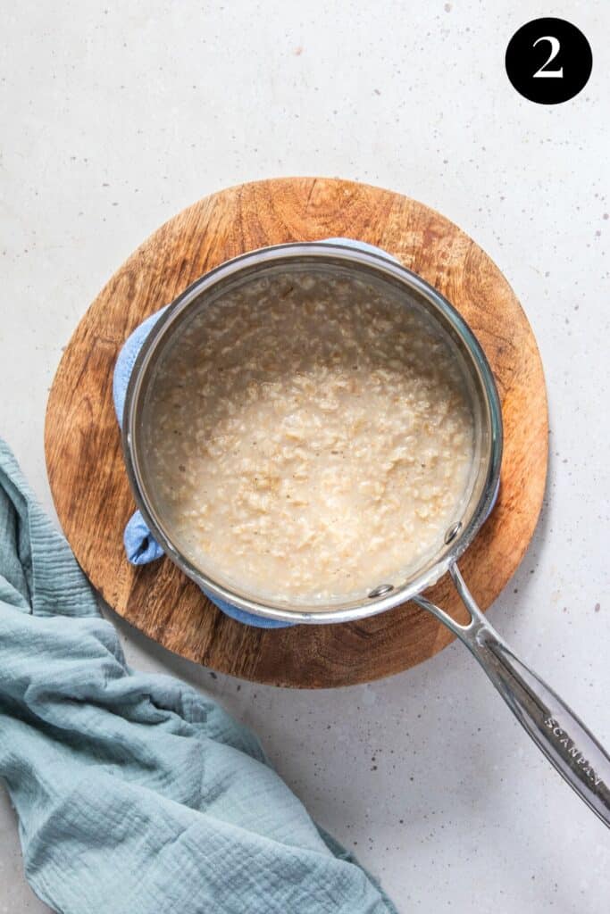 cooked oats in a saucepan. The water has been absorbed.