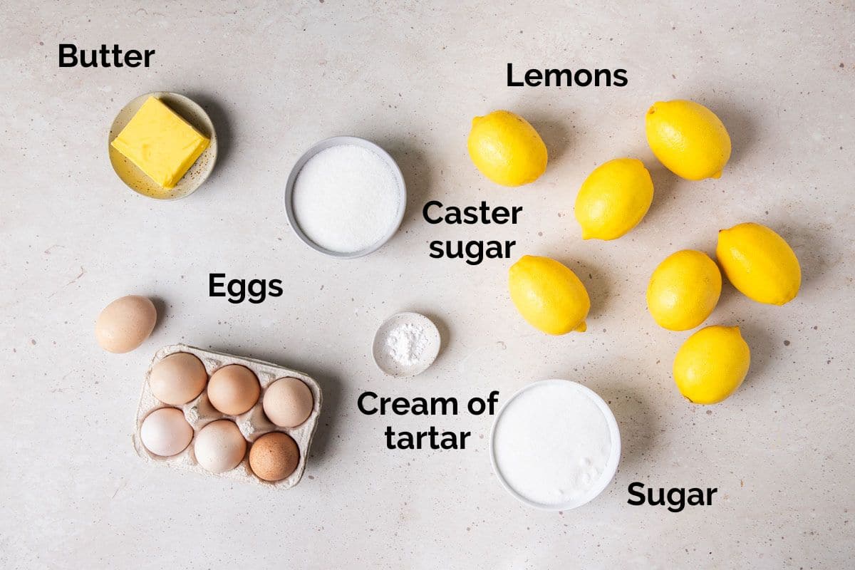 ingredients for lemon curd and meringue, laid out on a table.