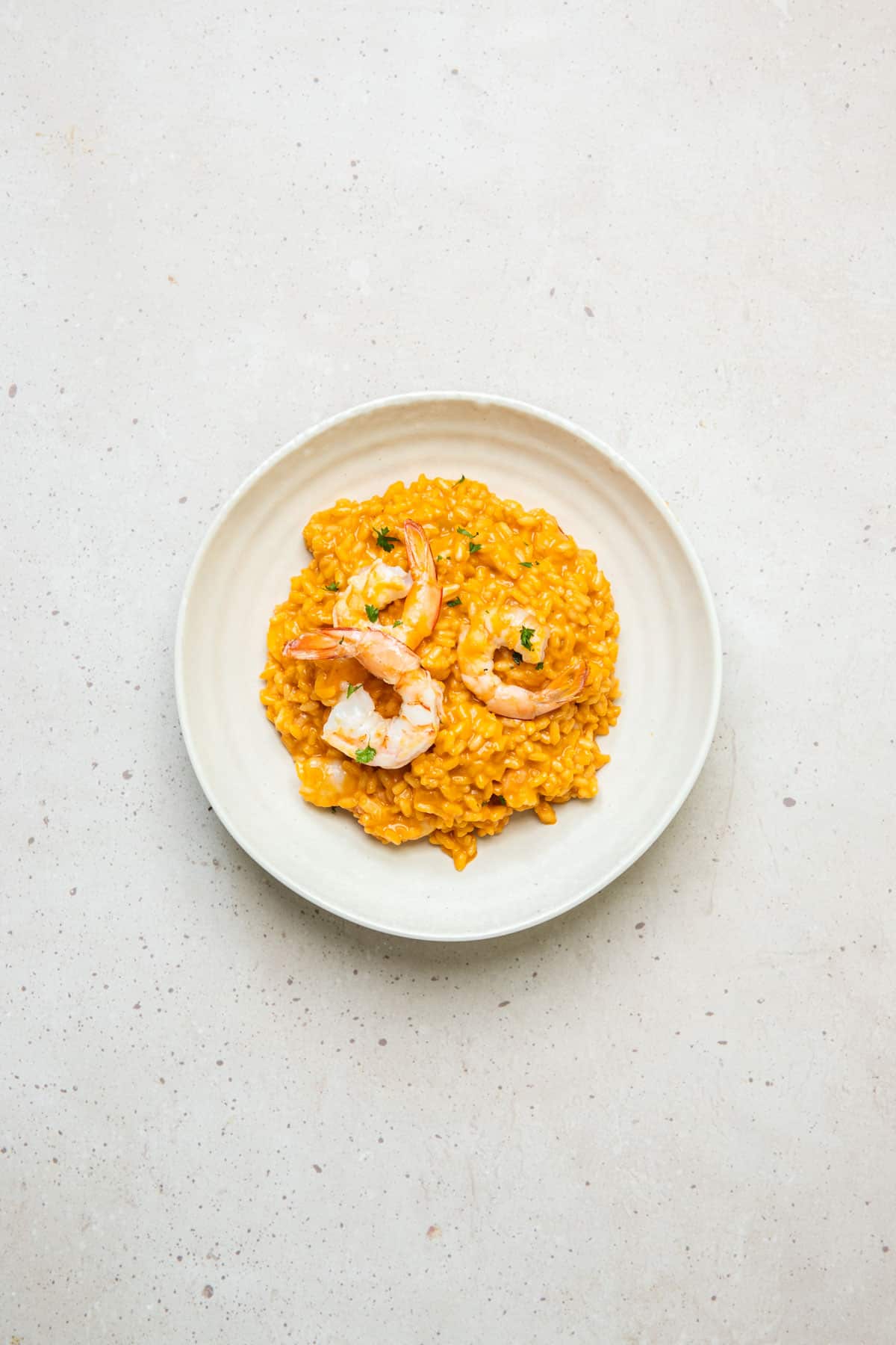 a bowl of risotto on a table.