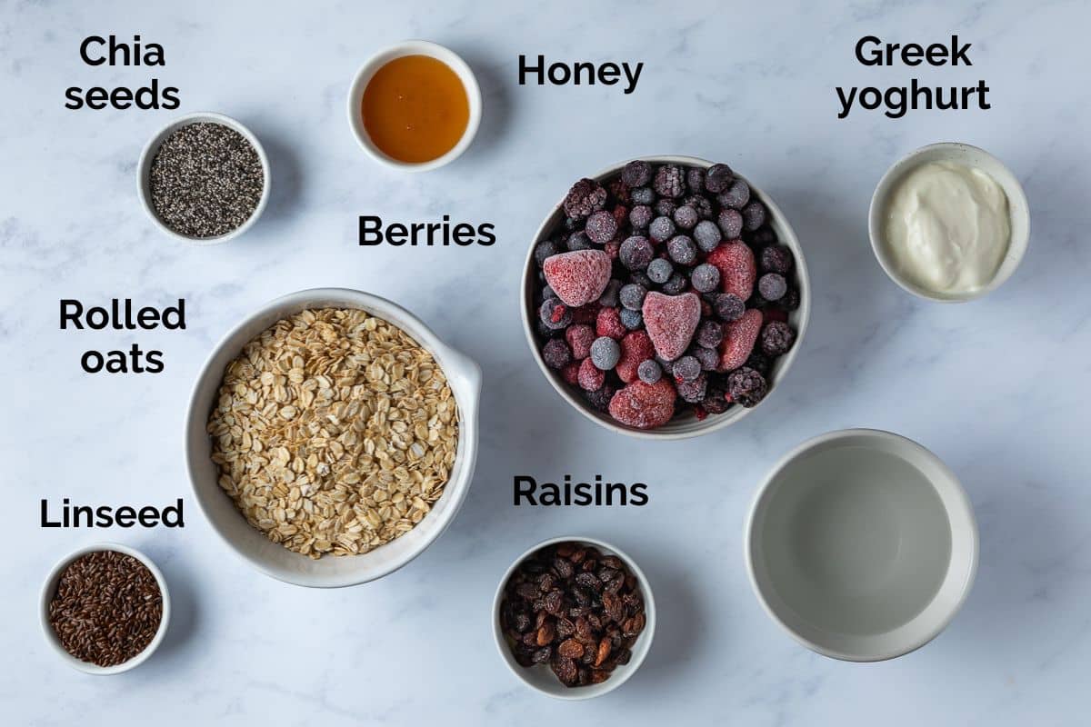 all ingredients for berry porridge, laid out on a table.