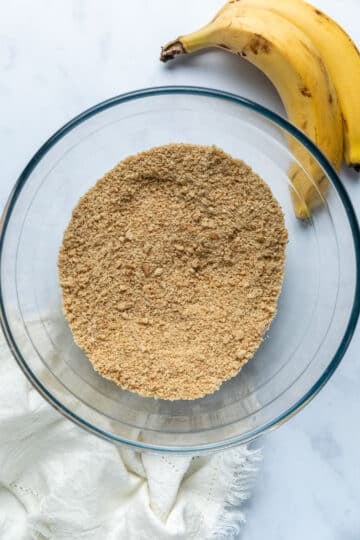 crushed biscuits in a mixing bowl.