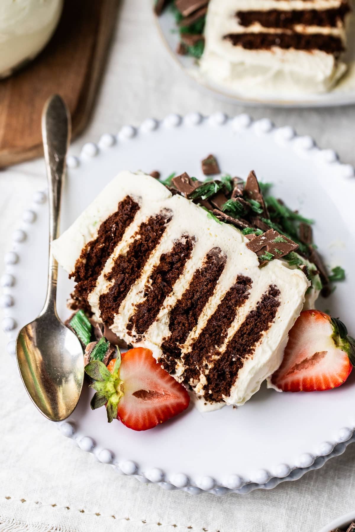 a slice of chocolate ripple cake, arranged on a plate with peppermint crisp.