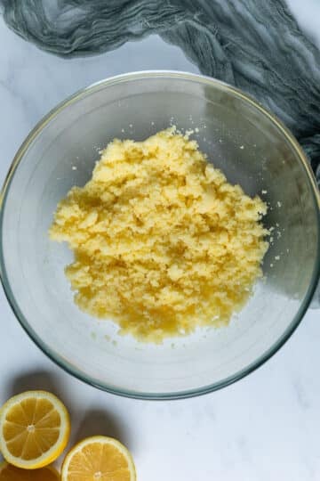 butter and sugar beaten together in a bowl.