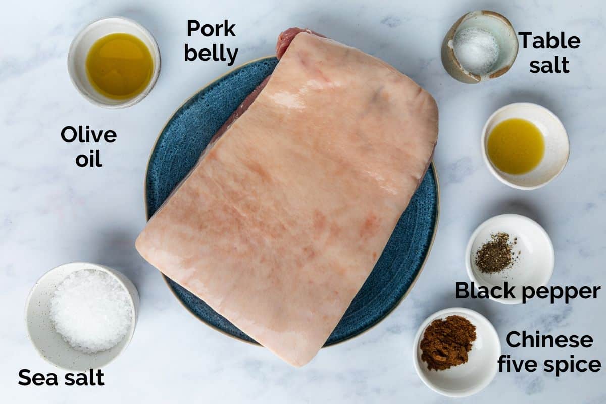 all ingredients for air fryer pork belly, laid out on a table.