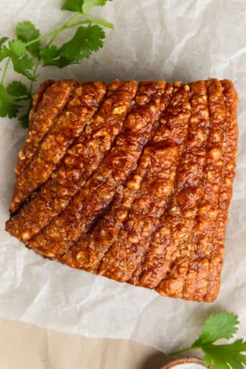 finished pork belly on a board.