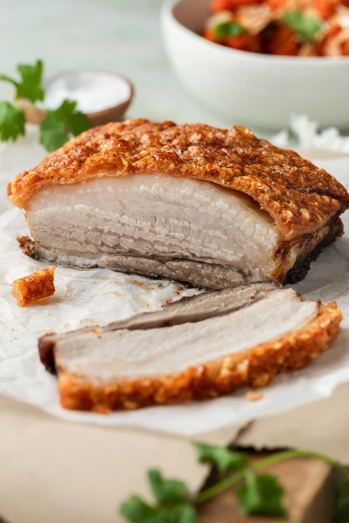pork belly sliced on a table with crispy crackling.