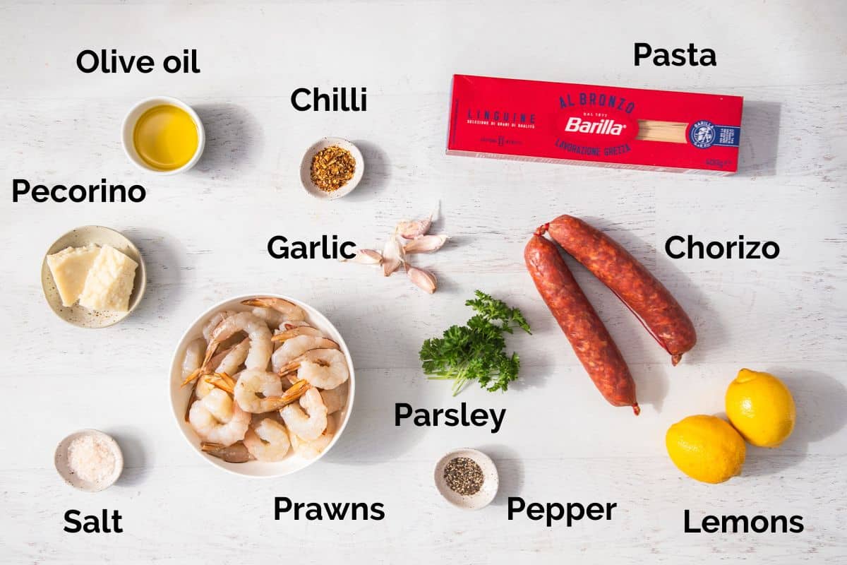 all ingredients for prawn and chorizo pasta, laid out on a table.