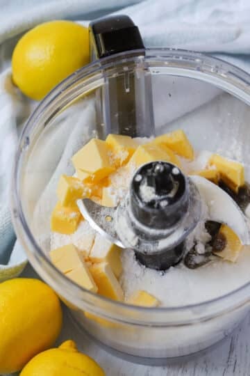 a food processor with shortbread base ingredients.