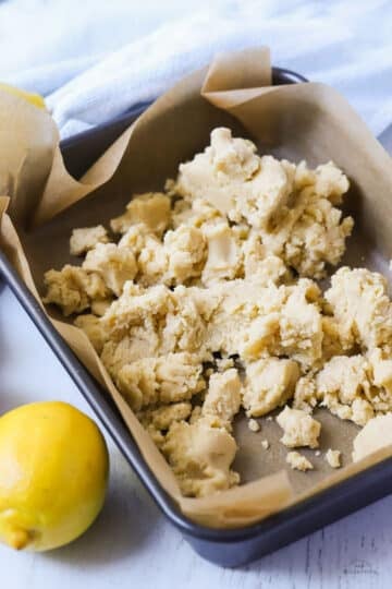 shortbread base ingredients in a lined baking tin.