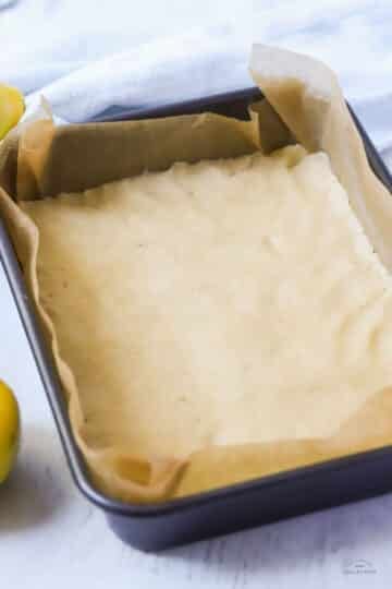 shortbread mixture pressed into baking tin.