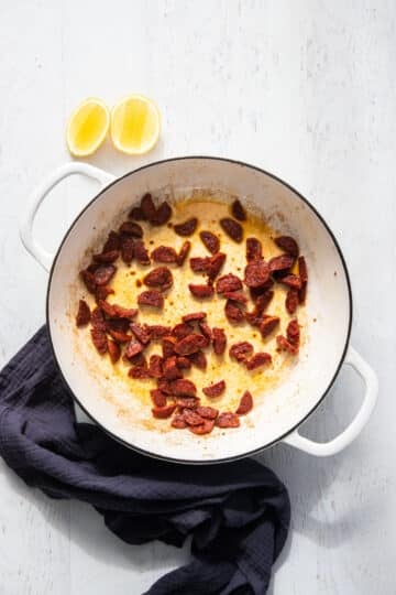 a pan with oil and fried chorizo.