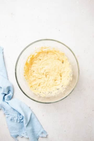 butter and sugar creamed together in a mixing bowl.