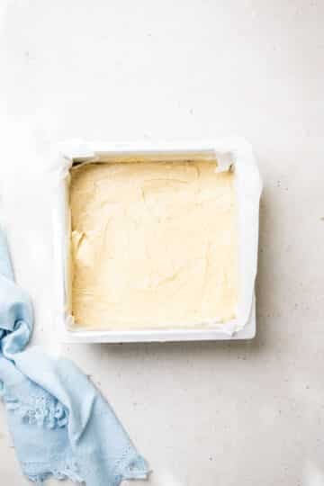cake mixture in a square baking tin.